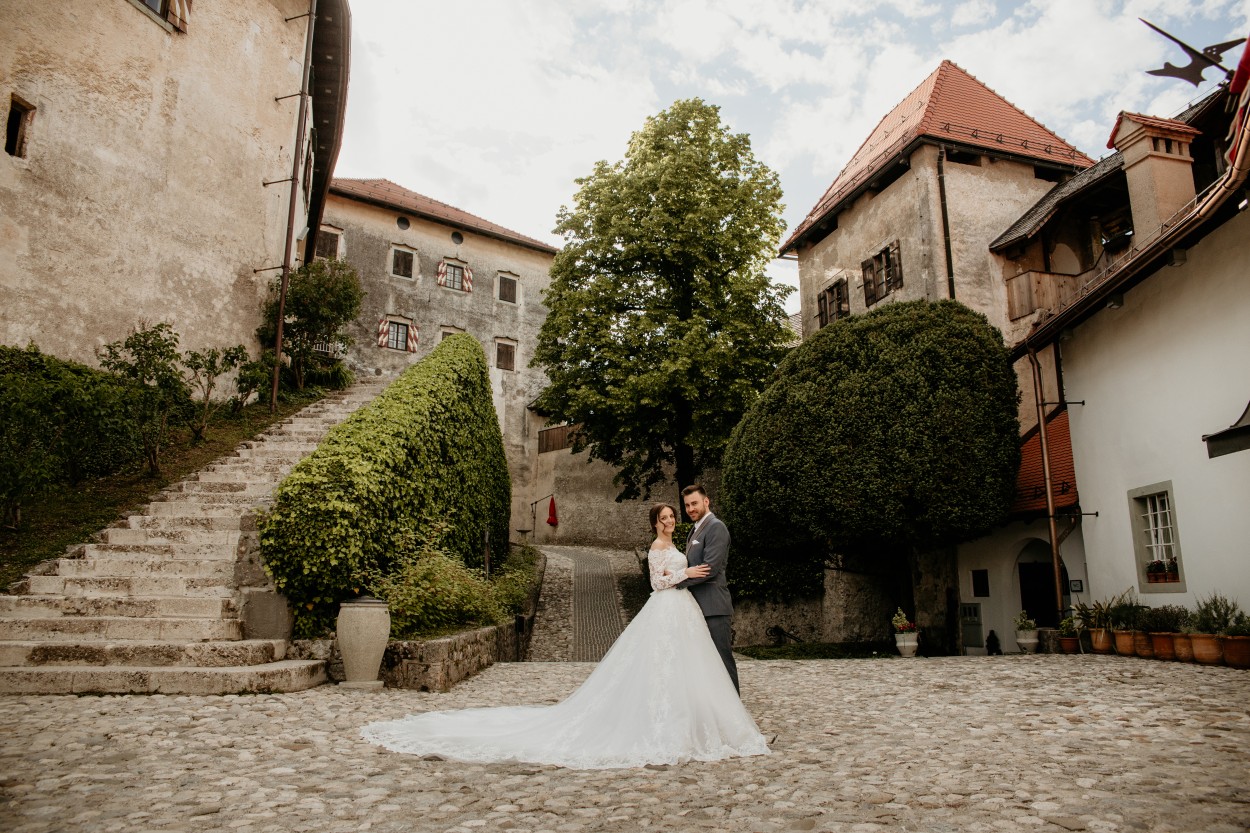 Bride and groom hug before Lake Bled Castle wedding.jpg
