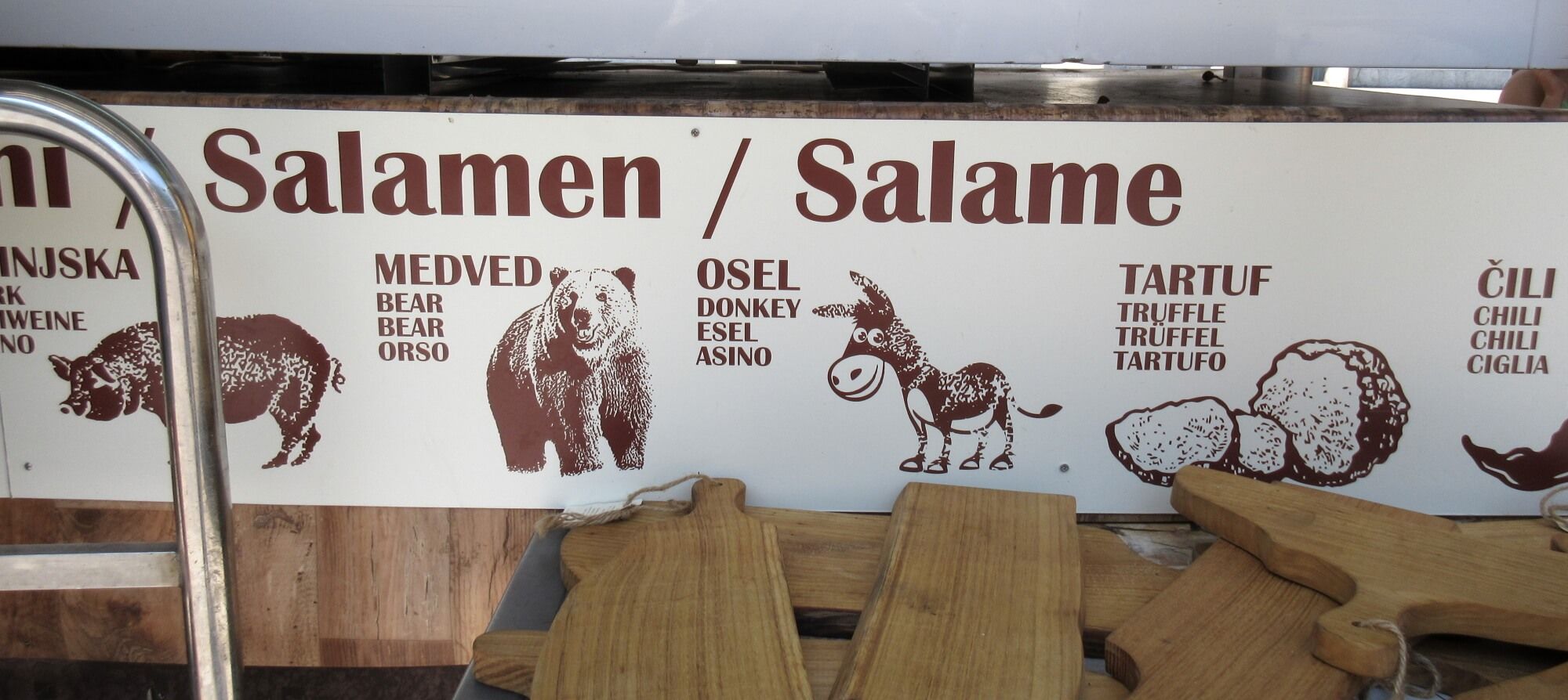 jl flanner august 2019 ljubljana market salami bear donkey.jpg