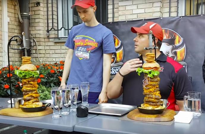 Mitch sizes up the challenge, while Randy sizes up Mitch