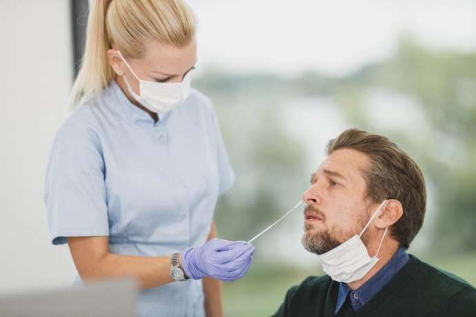 As Holidays Ends, Some Large Firms Test Staff for COVID