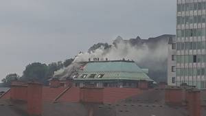 Smoke pours from the hotel