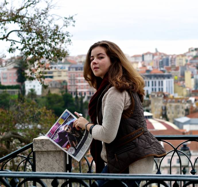 Woman reading a newspaper, Miradouro Santa Luzia, Lisbon