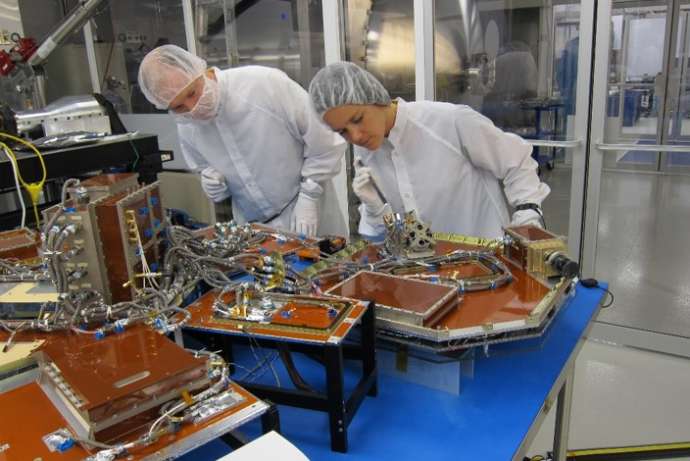 This is actually a picture of  NEMO-HD, the microsatellite, during integration. This will go into space along with Trisat, the nanosatellite