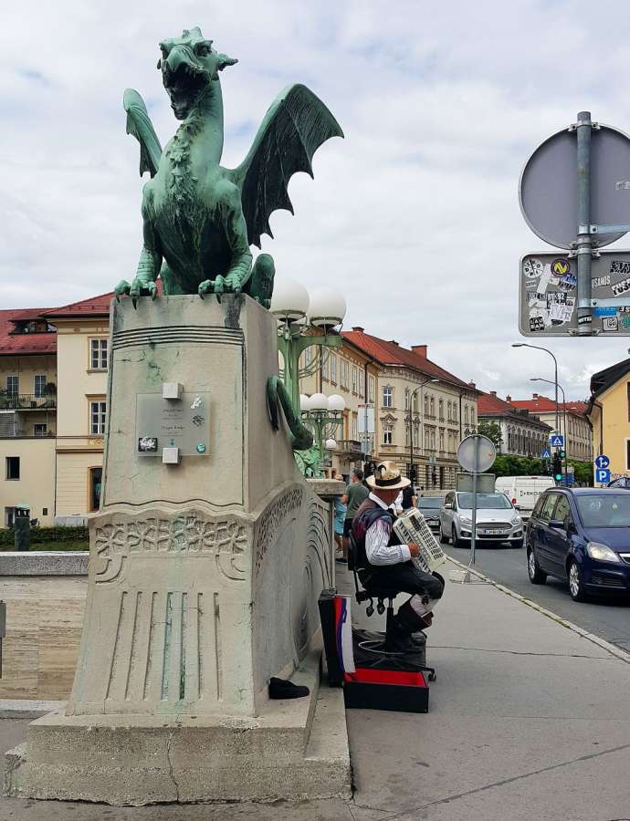 The Prešeren Square Accordionist Moves to Dragon Bridge